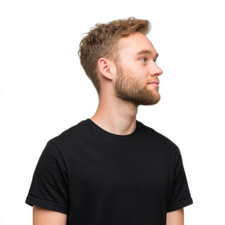 A young man with curly hair sports a black shirt in this casual portrait, exuding confidence, charm, and a relaxed vibe suitable for lifestyle branding.の素材