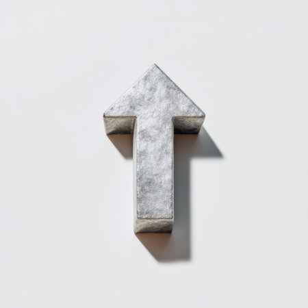 A metallic arrow symbol positioned on a minimalist background, representing growth and direction. This 3D object conveys themes of progress and success, ideal for business and motivational visuals.の素材