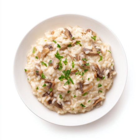 A delicious creamy risotto featuring mushrooms and garnished with fresh parsley, showcasing an inviting presentation perfect for any gourmet meal.の素材