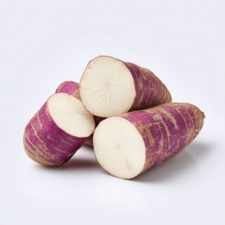 Freshly cut purple yam pieces reveal their striking color and unique texture, perfect for enhancing culinary creations and promoting healthy eating habits.の素材