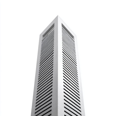 A striking modern office building with vertical lines set against a bright sky. The minimalist design emphasizes height and geometric patterns.の素材