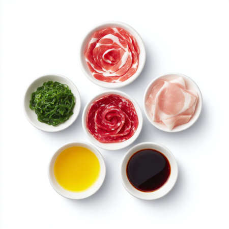 A vibrant assortment of ingredients arranged for hot pot, featuring slices of meat, fresh vegetables, and flavorful sauces perfect for sharing.の素材