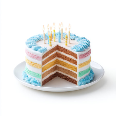 A vibrant layered cake featuring blue, pink, and yellow frosting with lit candles, perfect for birthdays and celebrations. This joyful dessert evokes happiness and festivity.の素材