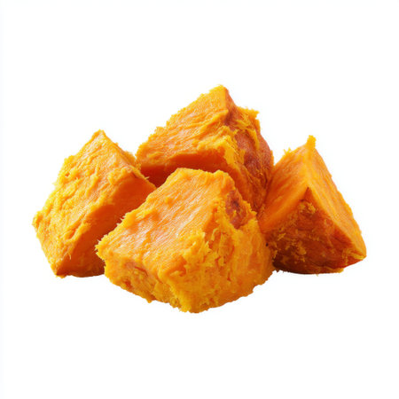 Bright and appealing sweet potato chunks showcased on a clean white background, perfect for health-focused cooking and visually enticing dishes.の素材