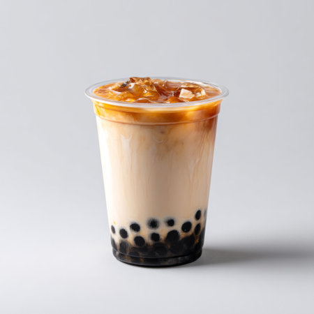 A delightful bubble tea featuring a creamy base and caramel drizzle, served chilled with ice. Perfect for warm days and enjoying in cafes.の素材