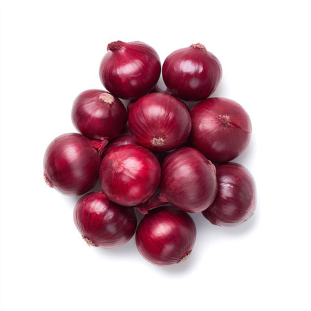 This image features a vibrant pile of fresh red onions on a clean white background, ideal for culinary use and healthy meal preparation.の素材