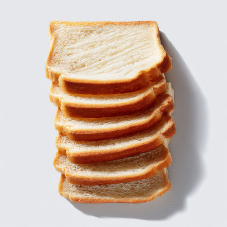 A stack of neatly sliced white bread showcasing a soft texture and inviting appearance. Perfect for bakery themes, cooking, or culinary projects.の素材