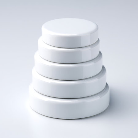 This image features a series of white cylindrical disks stacked in a neat arrangement on a smooth surface, creating a modern and minimalist aesthetic perfect for design and decor applications.の素材