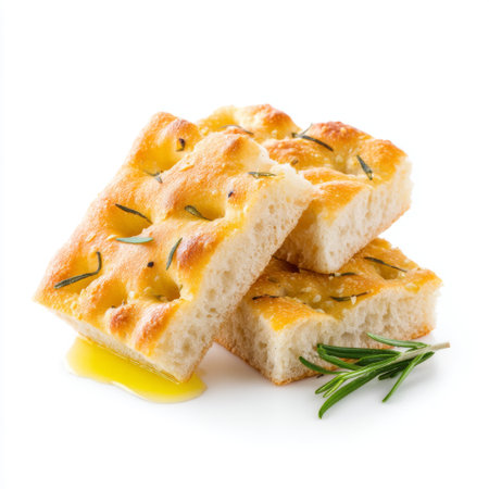 A delicious golden brown focaccia bread slice drizzled with olive oil and garnished with fresh rosemary, ideal for enhancing any meal or snack.の素材