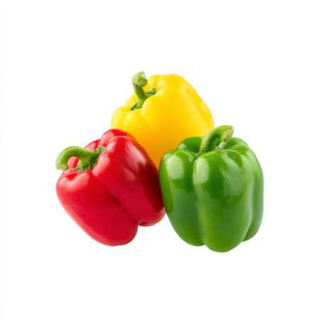 A trio of fresh bell peppers in red, green, and yellow colors, perfect for enhancing your dishes, promoting healthy eating, and inspiring creative recipes.の素材