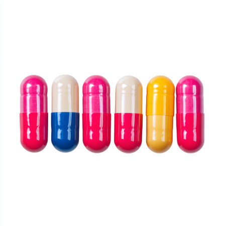 Vibrant arrangement of colorful capsules on a white background, perfect for representing health, wellness, and modern pharmaceutical concepts.の素材