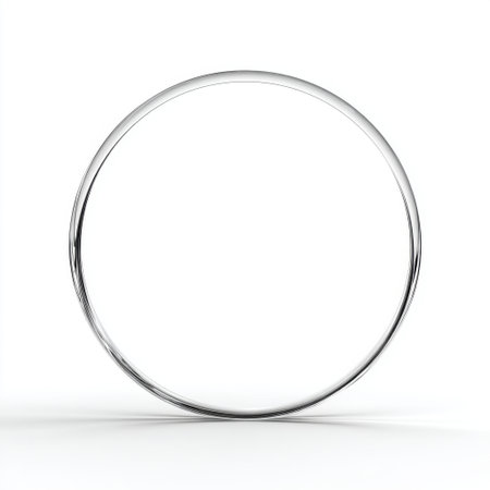 A minimalist shiny metal circle is beautifully isolated on a white background, representing simplicity and elegance in modern design. Perfect for creative projects.の素材