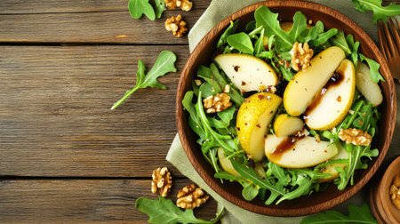 Enjoy this fresh arugula salad featuring sliced pears and walnuts, showcasing vibrant colors and textures. A perfect healthy meal or side dish choice.の素材