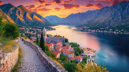 Experience the stunning beauty of Kotor Bay at sunset. This panoramic view showcases the vibrant colors reflecting on the serene waters, framed by majestic mountains.の素材