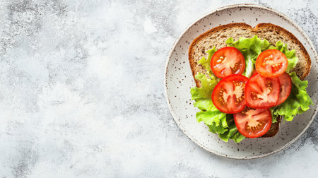 A vibrant and mouthwatering sandwich featuring fresh tomatoes and crisp lettuce on rustic bread, perfect for a healthy meal or snack.の素材