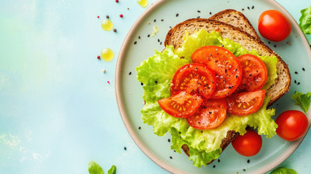 A vibrant flat lay featuring a mouthwatering sandwich filled with fresh lettuce and juicy tomatoes on whole grain bread, perfect for a healthy meal.の素材