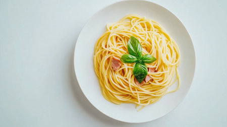 A beautifully presented spaghetti dish topped with fresh basil, capturing the essence of a simple yet appetizing meal. Perfect for food lovers and culinary enthusiasts.の素材