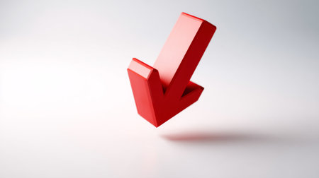 Bright red downward arrow against a clean white background creates a striking visual element for various business and creative concepts.の素材