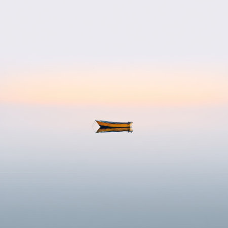 A solitary boat floats on a calm body of water, reflecting a pastel sky at dusk. This tranquil scene evokes peace and simplicity in nature, perfect for relaxation.の素材
