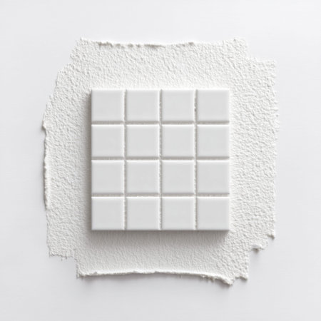 This image features a clean arrangement of white tiles on a textured white background, perfect for modern interior design projects. It highlights simplicity and elegance.の素材