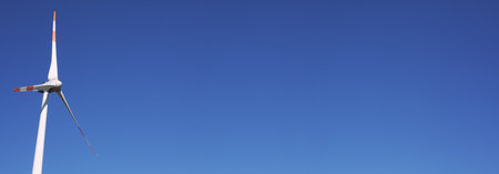 An image of wind turbine generator on a clear blue skyの写真素材