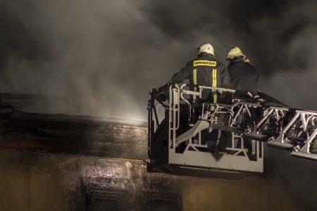 Firefighters fighting fireの写真素材