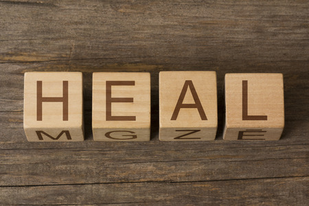 the word of HEAL on wooden cubesの写真素材