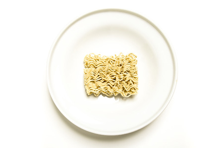 uncooked noodles on a white plate