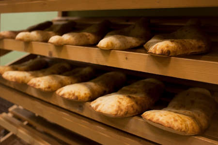 Pita bread on the shelf in the bakery. Bakery products.