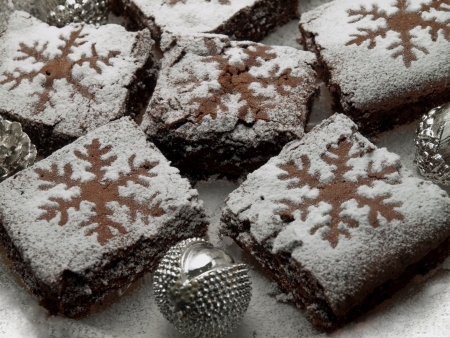 Freshly baked brownies on a plate with christmas decoration の写真素材