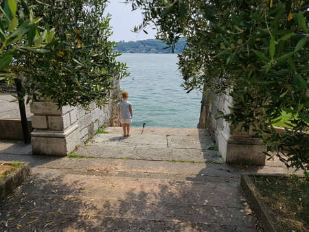 Little girl overlooking lake Garde, Italy