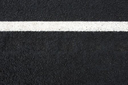 Road and white road marking (horizontal) with text space seen from aboveの写真素材
