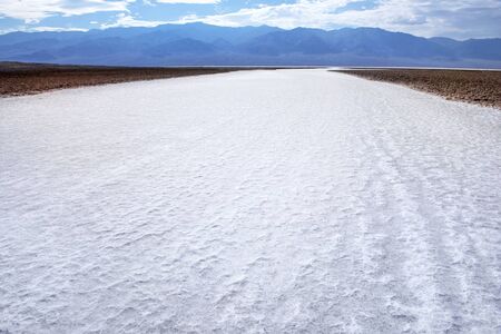 Road from salt at Badwater Basin (Death Valley National Park)の写真素材