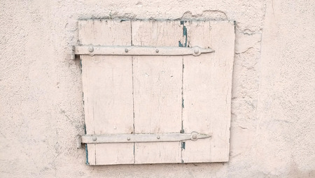 Small and old rose coloured wooden door