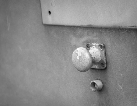 Weathered abstract doorknob in black and white