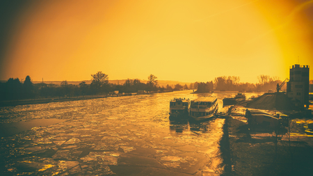 Small harbour view and a frozen riverの写真素材