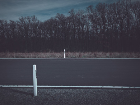 Rural scene of a dark roadの写真素材