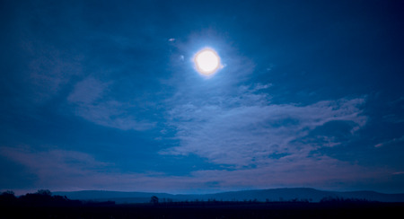 Night sun is shining above the rural landscapeの写真素材