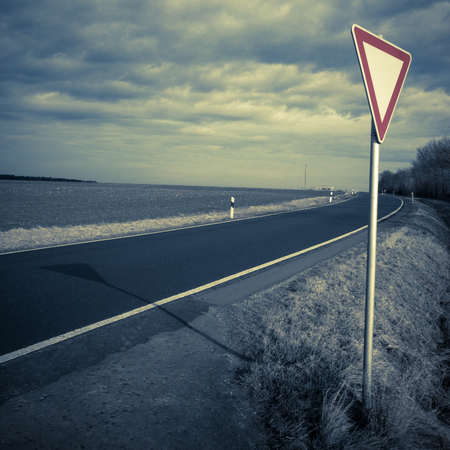 Rural street view with a traffic signの写真素材