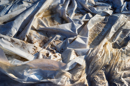 White and dirty tarpaulinの写真素材