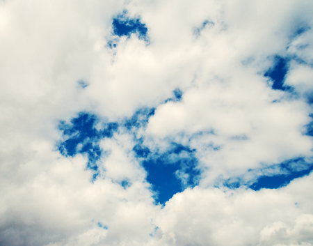 Cloudscape background with blue sky behindの写真素材