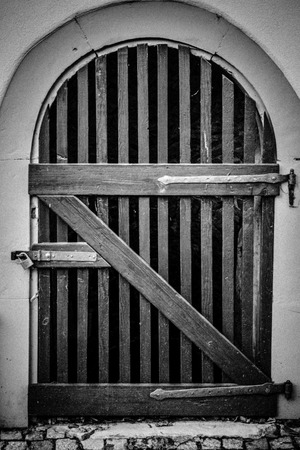 Old wooden basement doorの写真素材