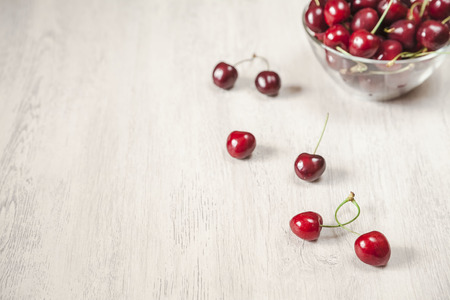 Fresh cherries on the wooden tableの写真素材