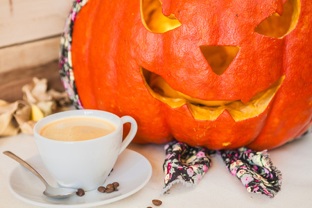 Pumpkin in colorful bandana on a wooden backgroundの写真素材