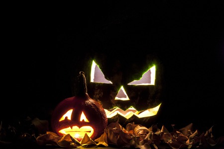 Halloween. Jack O' Lantern on the black with leaves.の写真素材