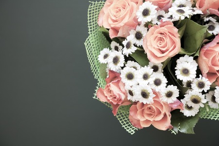 Flowers background. Vintage style. Roses and daisiesの写真素材