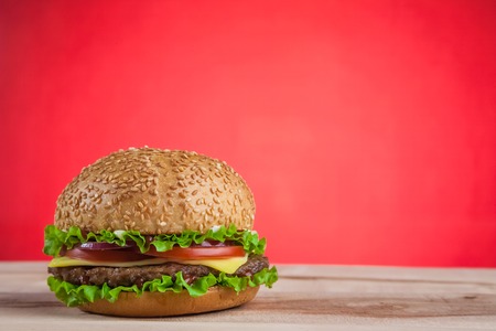 Homemade grilled hamburger on the wooden tableの写真素材