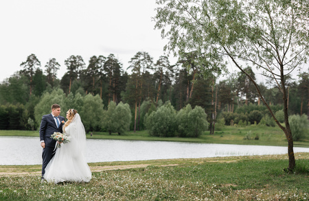 Wedding day. Young couple on the natureの写真素材