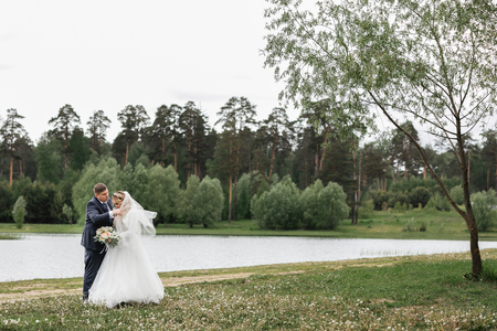 Wedding day. Young couple on the natureの写真素材