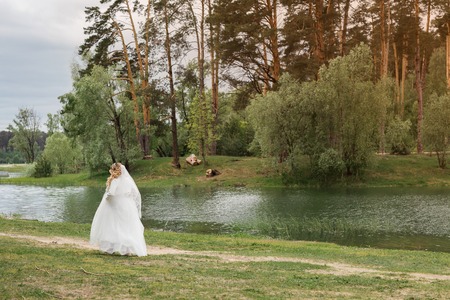 Wedding day. Bride on the nature. Summertimeの写真素材